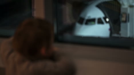 boy looking at the plane