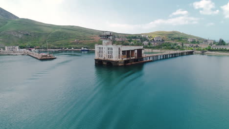 abandoned military facility on a coastal bay