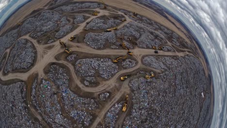 aerial view of landfill with heavy machinery