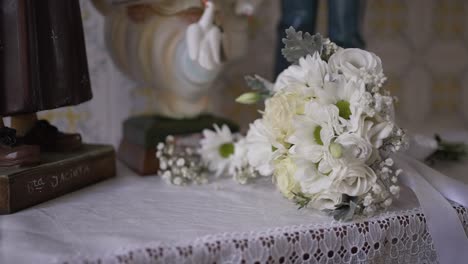 White-bridal-bouquet-on-lace-table