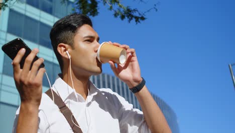 man having coffee while talking on mobile phone 4k