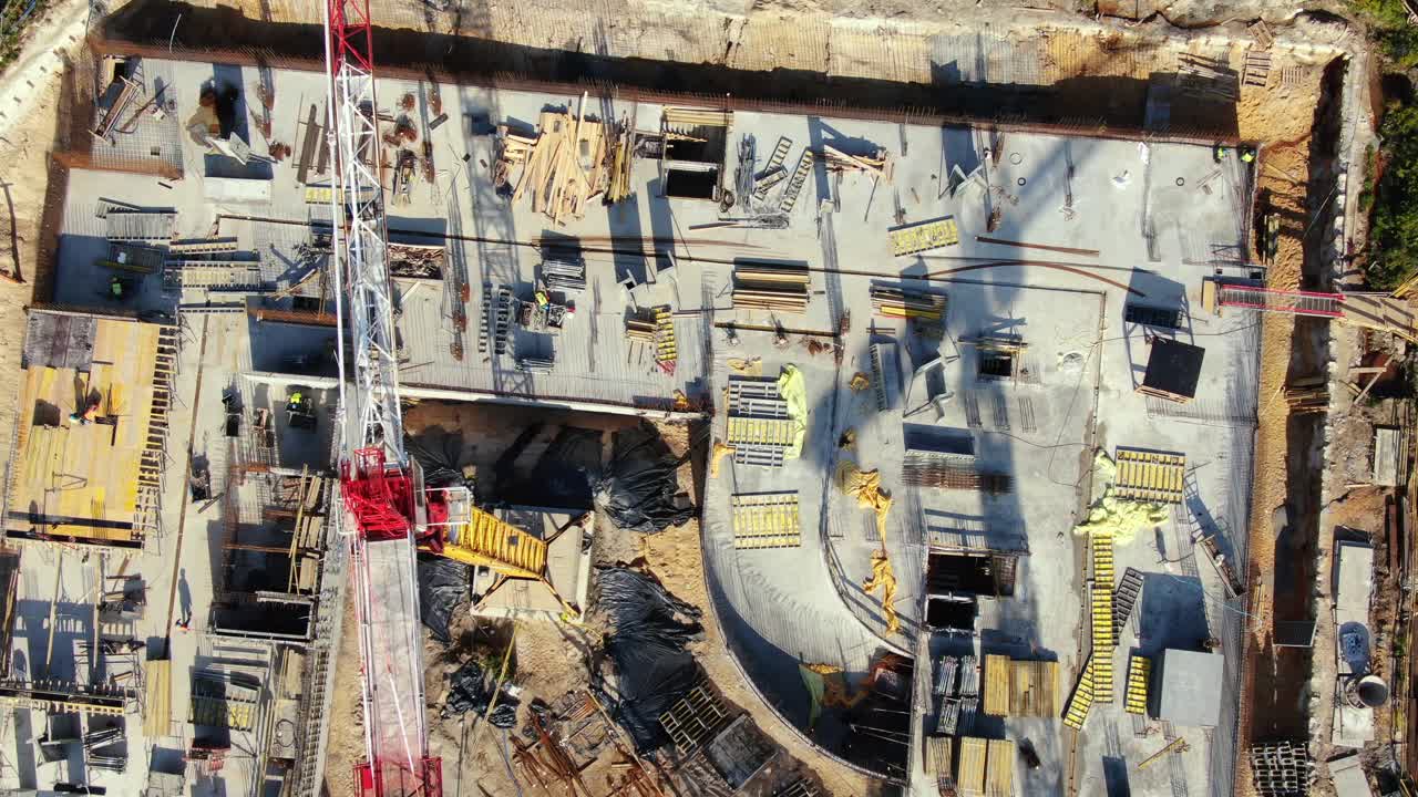 Aerial Flight Over a New Constructions Development Site with High Tower Cranes Building Real Estate