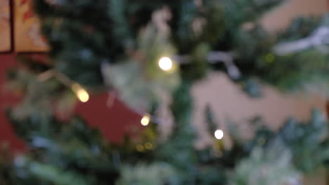 blurred christmas tree with yellow lights and red background