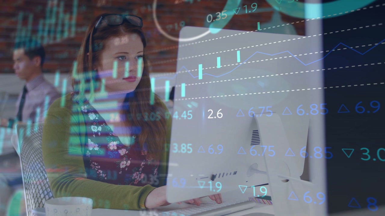 Woman typing at desk, initiating animated finance charts overlaying monitor, aiding market analysis