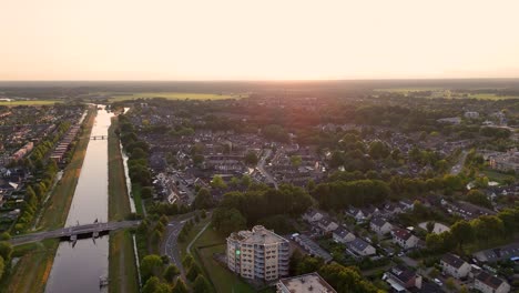 aerial view of a town with a canal at sunset