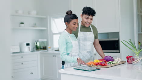 Cooking,-couple-and-conversation-in-kitchen