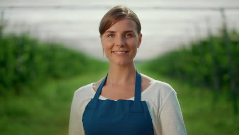 Farmer-professional-looking-camera-in-berry-production-season.-Summer-concept.