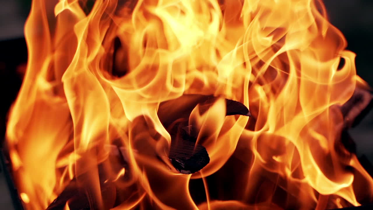 Burning fire. Bonfire. Close Up of flames burning on black background, slow motion