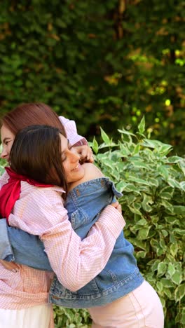 two friends hugging outdoors