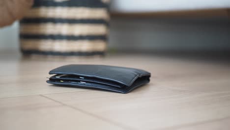 black wallet on a wooden floor