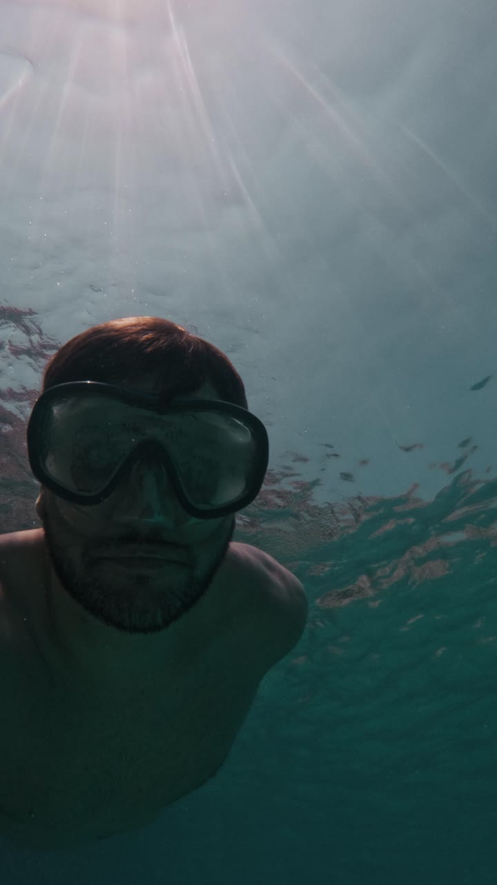 POV Man Swimming Underwater In Clear Ocean