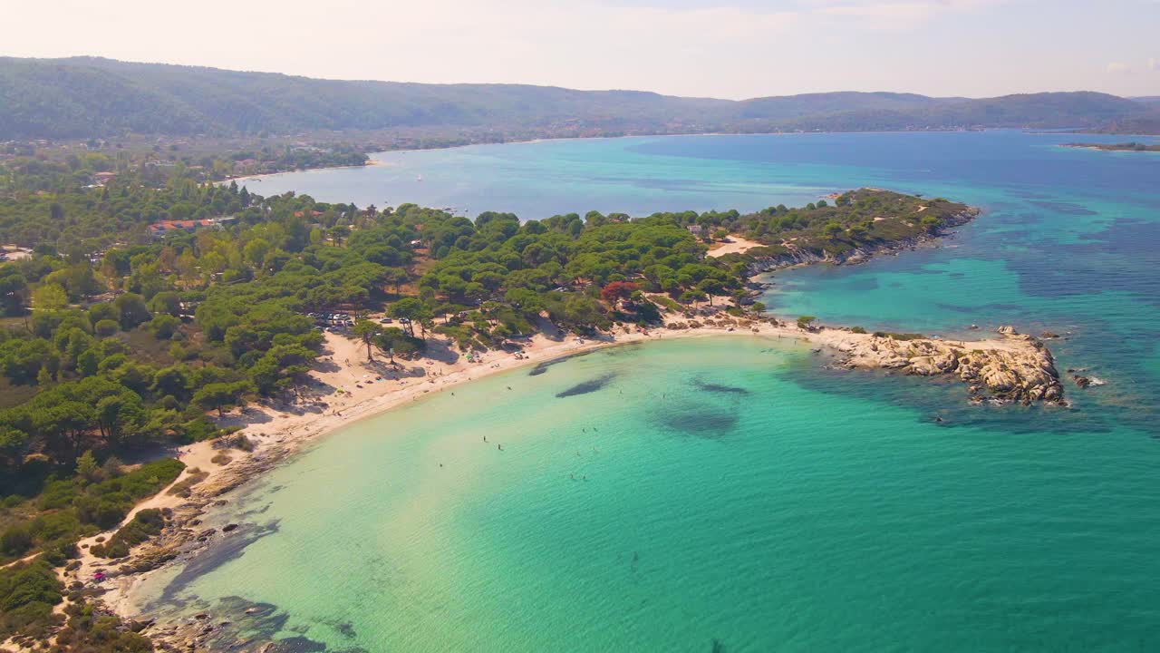 Aerial drone clip over an exotic beach in Vourvourou, Chalkidiki, Greece
