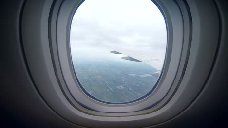 zooming into view out of plane window while travelling onto next adventure