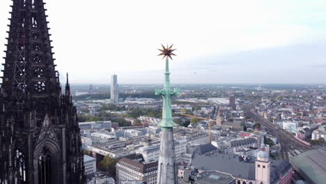 tight aerial arc view of gothic twin-spires of cologne cathedral church, germany