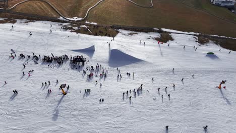 crowd of people near winter skiing track freestyle ramp, dolni morava