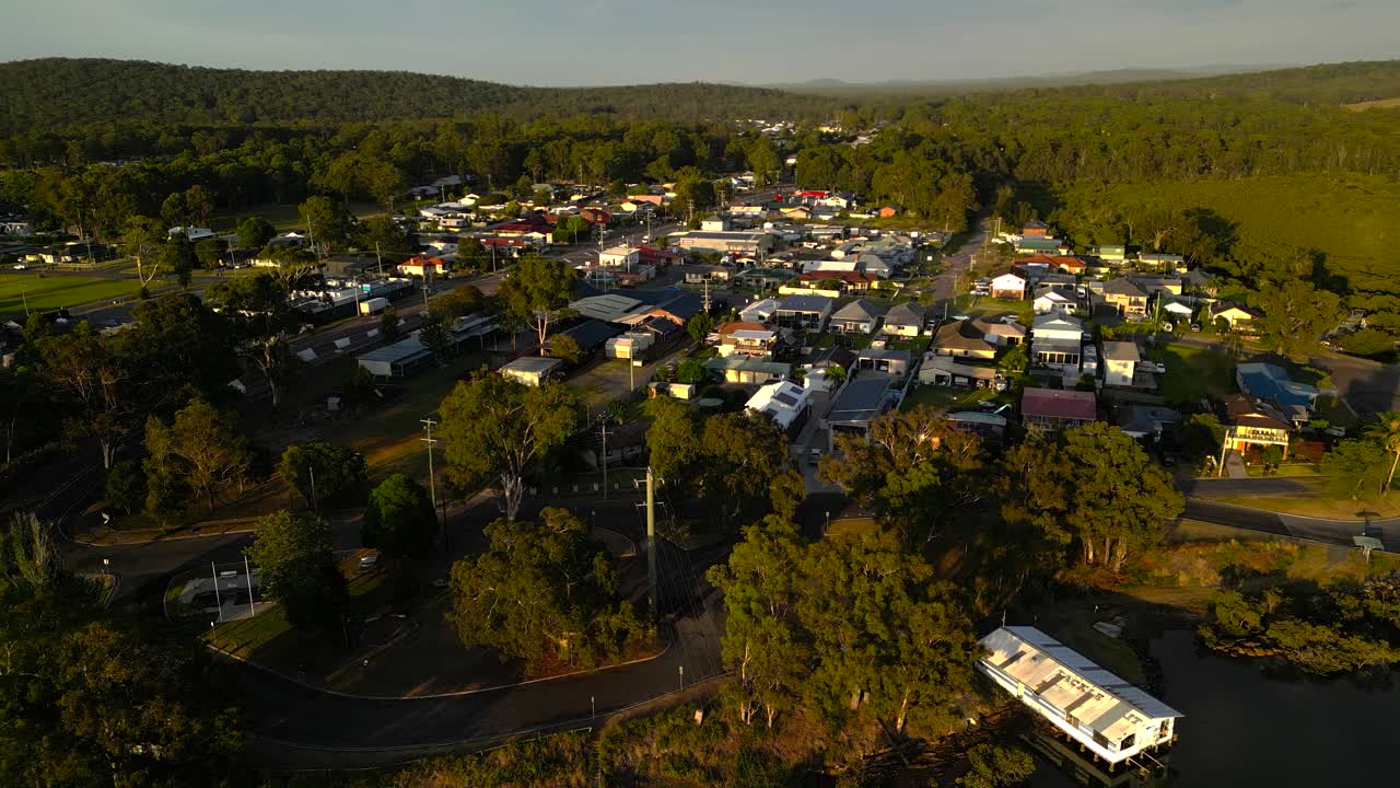 Left to right sunrise aerial view of the regional town of Karuah, New South Wales, Australia.
