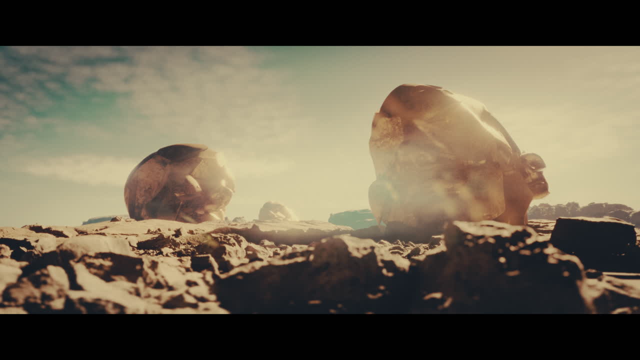 Huge golden statues in the desert during sunset
