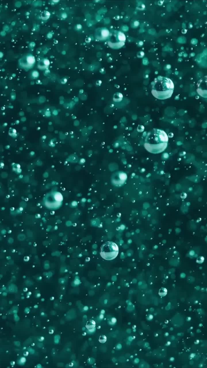 Macro Shot of Teal Bubbles Floating in Fluid