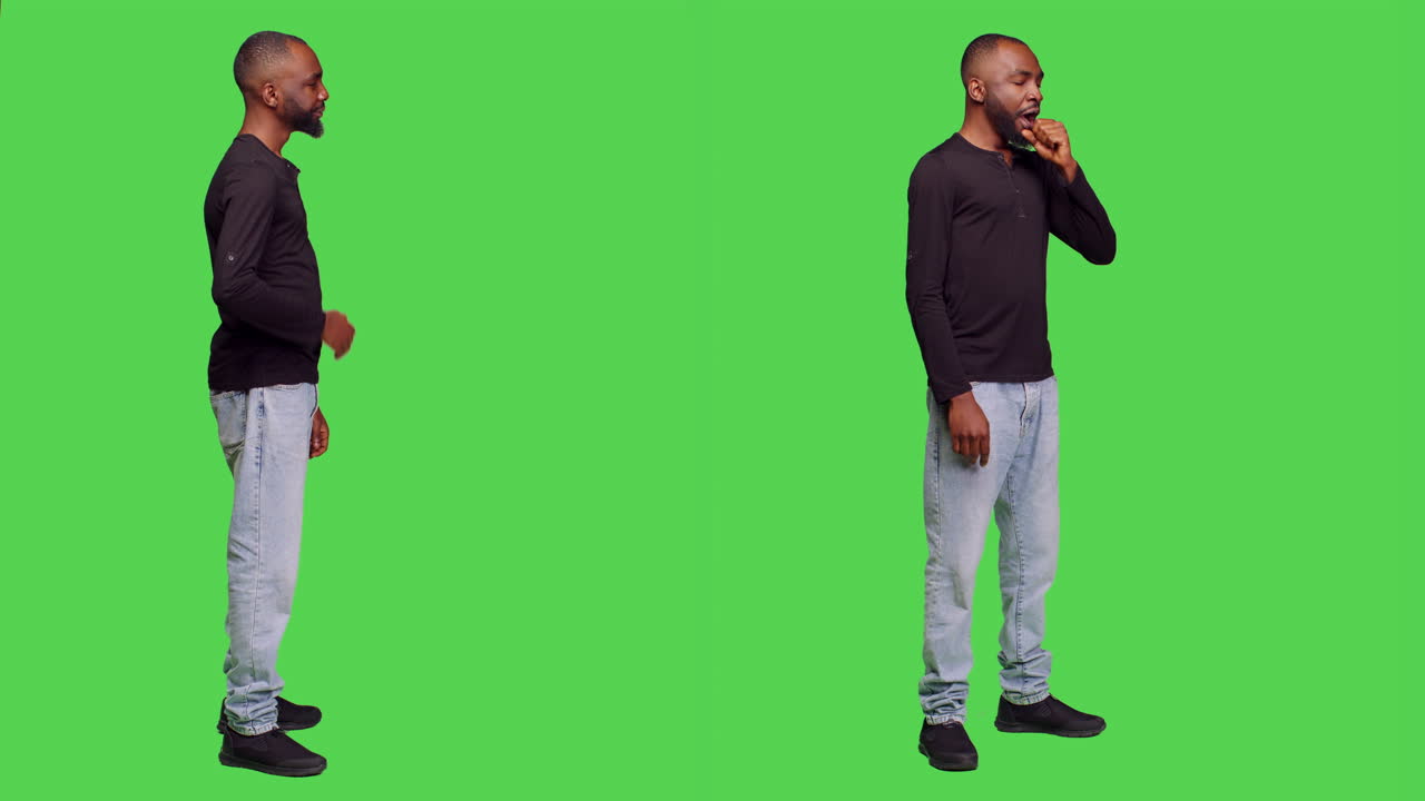 Man on green screen praying and yawning