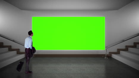 businessman looking at green screen