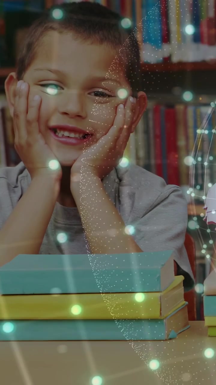Vertical video: Kids sitting camera panning left revealing peer, books teal dots showing for school