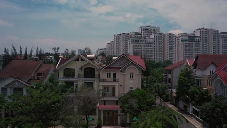 Aerial-suburban-view-on-sunny-day-with-large-apartment-and-housing-development-on-river-5