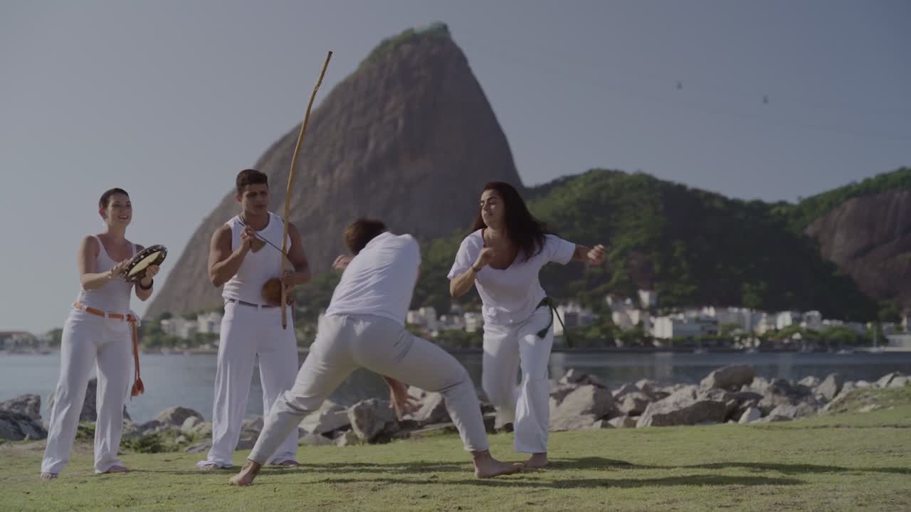 Capoeira session in Rio de Janeiro with Sugarloaf Mountain background