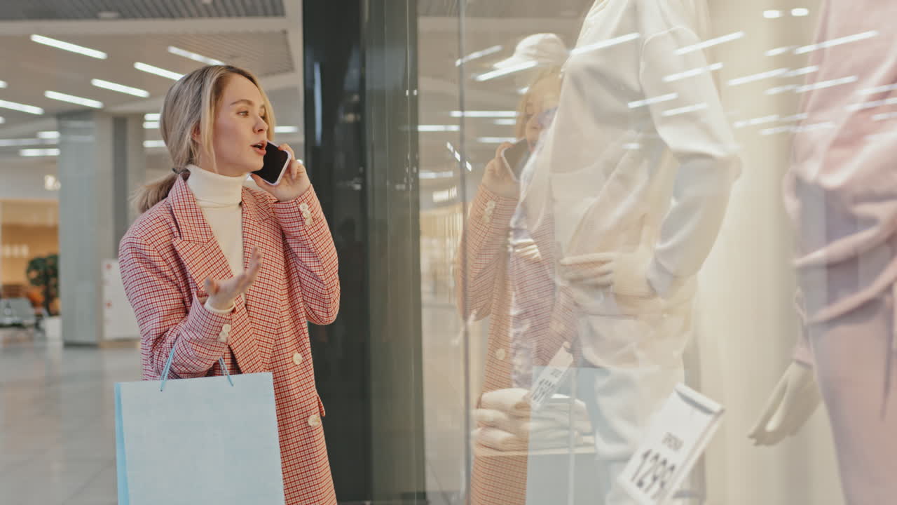 Modern Young Woman Talking On Phone At Shopping Mall