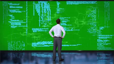 businessman coding on green interface