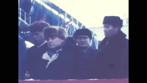 men standing on top of a factory building. circa ussr 1970: men standing on top of a factory building