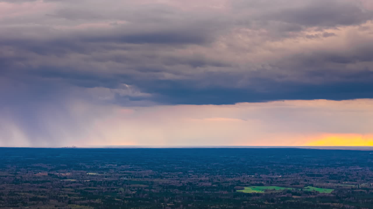 Dense Cloudscape Over Nature Landscape. Timelapse