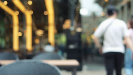 blurred motion of people in restaurant blur background