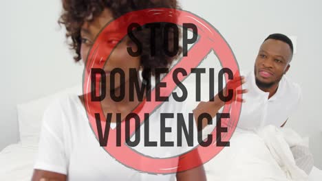 animation of stop domestic violence text over african american couple arguing