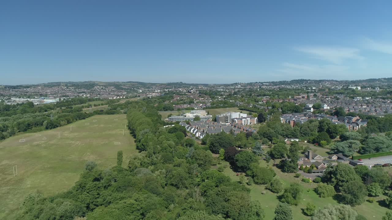Aerial approach towards Exeter in Devon, UK, on a sunny afternoon