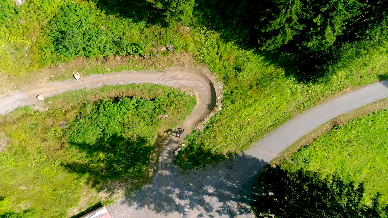 Footage of a person riding a bike on a track in Davos