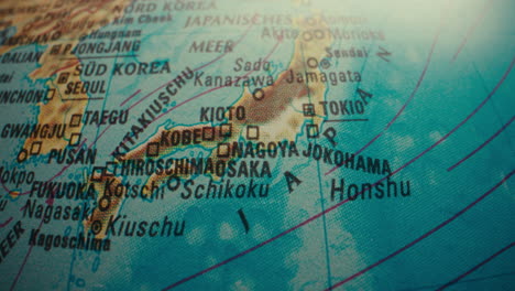 close-up of a vintage world globe focusing on japan