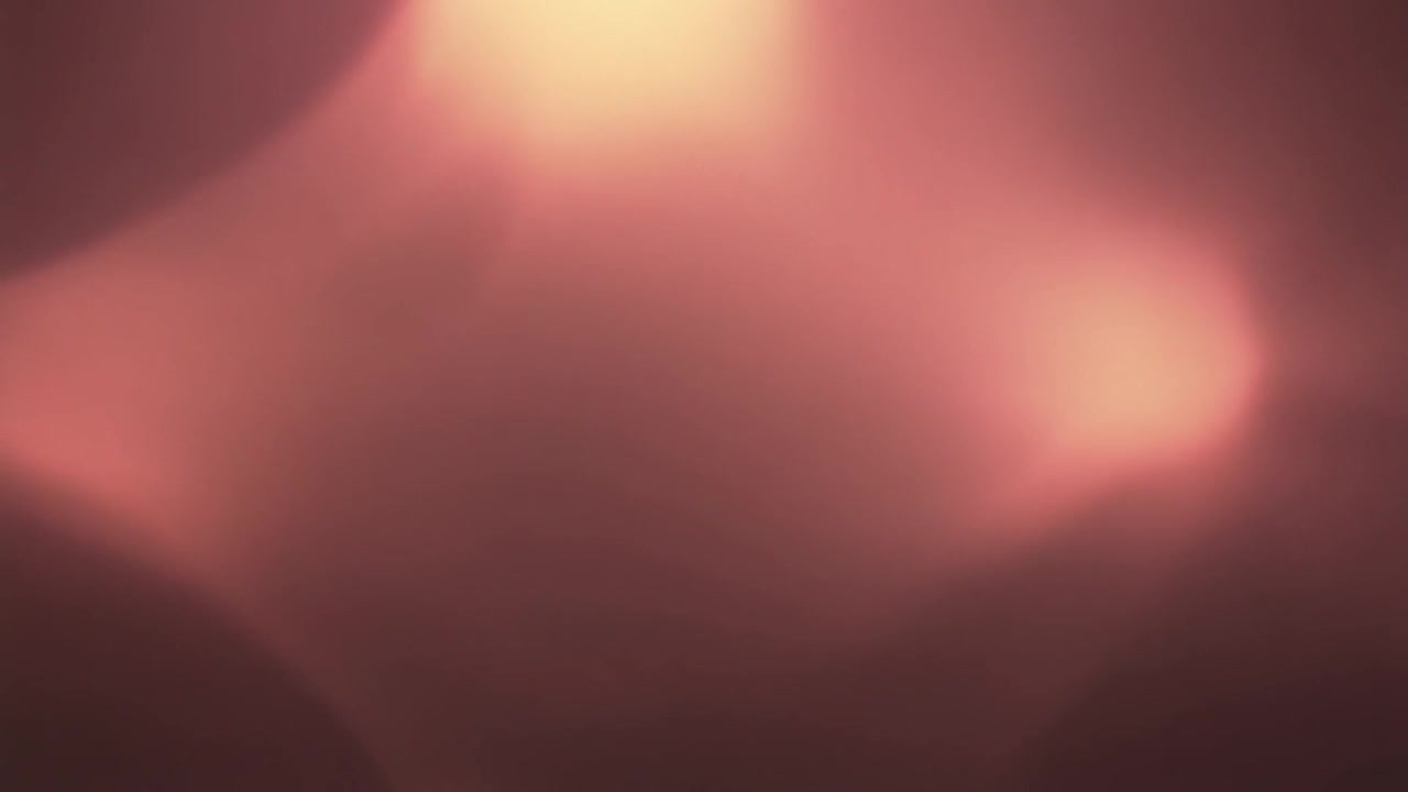Abstract Motion Background with Soft Glowing Pink and Warm Light Leaks