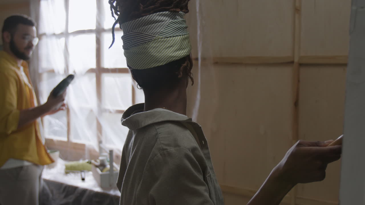 Two Artists Working in a Studio