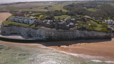 Kingsgate-castle-Kent-seaside-English-chalk-cliff-coastal-bay-landmark-Aerial-view-rising-in-reverse