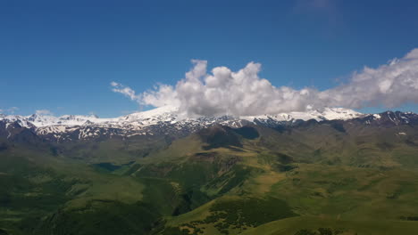 elbrus region. flying over a highland plateau. beautiful landscape of nature. mount elbrus is visible in the background.