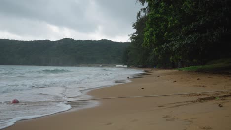 Dam-Trau-Beach-on-Con-Dao-Island-in-Vietnam-and-Waves-rolling-into-Seashore-On-A-Cloudy-day