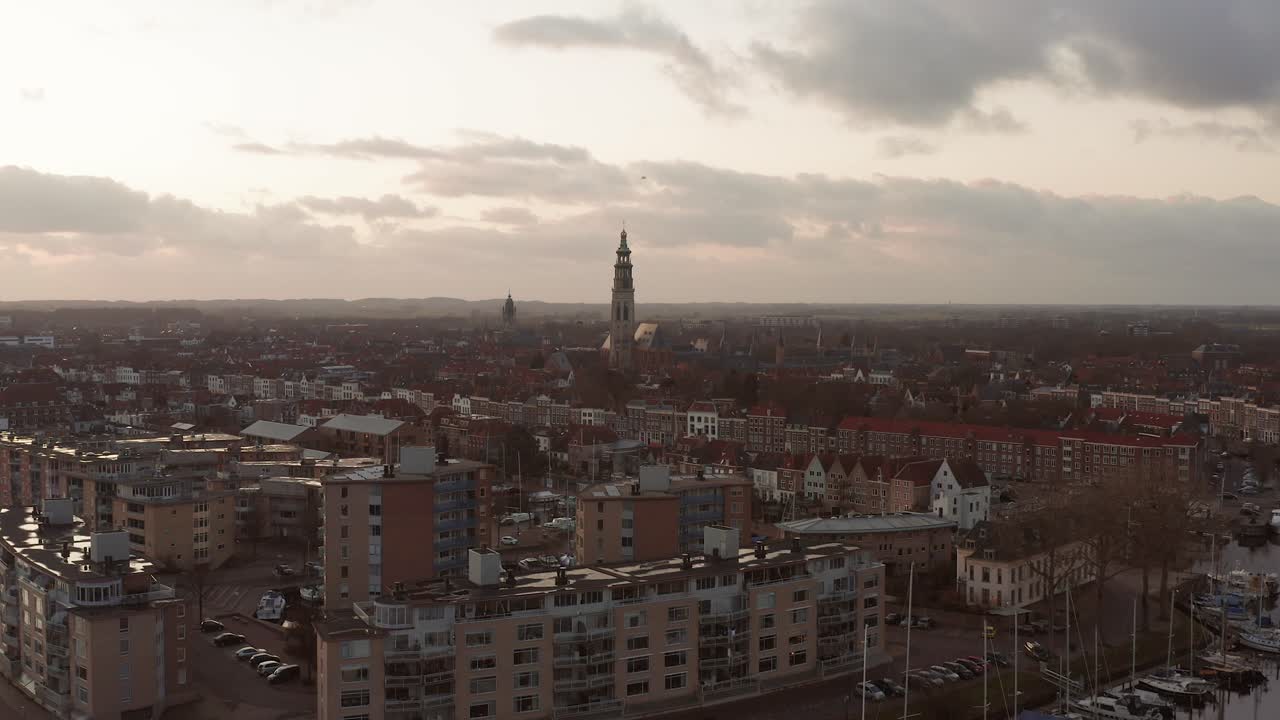 High angle shot of the historical city Middelburg, flying towards the big tower the Lange Jan. Drone shot