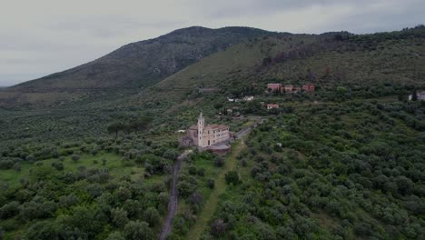 church sitting on a hillside surrounded by olive trees tivoli, italy