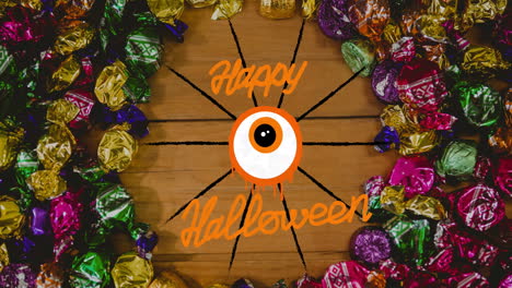 animation of happy halloween text over candy