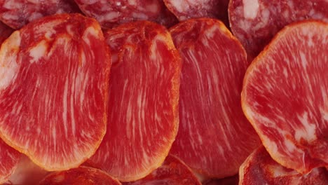 mix of spanish pork sausages, cutting board of appetizing catalonian snack - fuet, jamon, chorizo, olives, supermarket tapas food in spain, traditional cuisine.