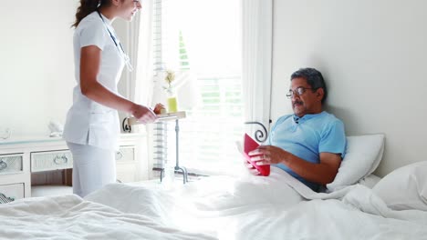 female doctor serving breakfast to senior man 4k