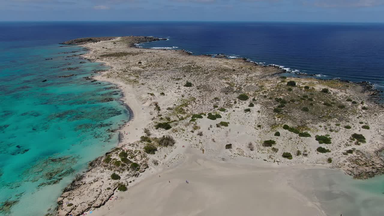 Elafonissi Beach peninsula in Kissamos province of Crete Greece, Aerial low altitude dolly in shot