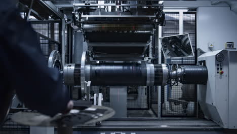 robotic tyre plant worker operating production process in factory close up