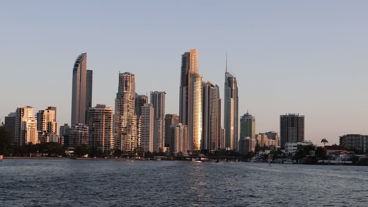 Time-lapse of a city skyline during sunset