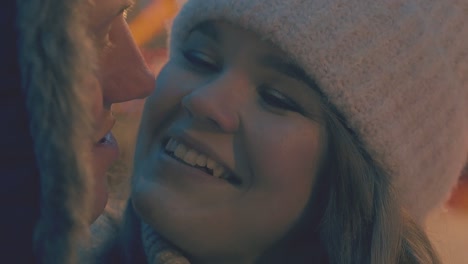 young woman looks at boyfriend at winter fair slow motion